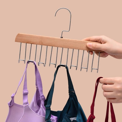 Wukusy space-saving wooden hanger with 8 hooks and included hanging hook, ideal for organizing clothing and accessories at home.