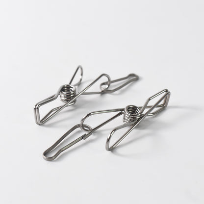 Stainless steel clothes pegs with one rope for hanging laundry, designed for durable home improvement use.