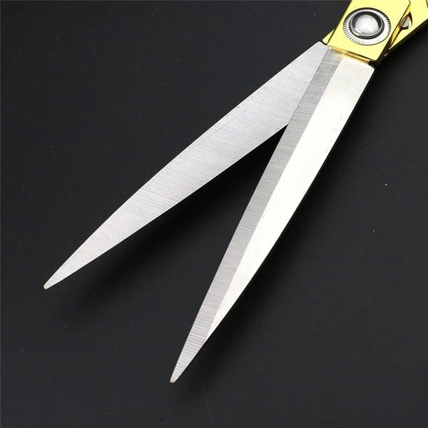 Golden stainless steel tailoring scissors from Wukusy for professional cloth cutting, perfect for home improvement projects.