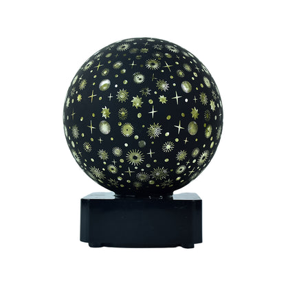 Wukusy Starry Sky Projector Night Lamp illuminating a dark room with star patterns, ideal for home improvement and relaxing ambiance.