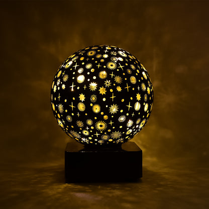 Wukusy Starry Sky Projector Night Lamp displaying a starry sky pattern on a wall in a cozy home setting