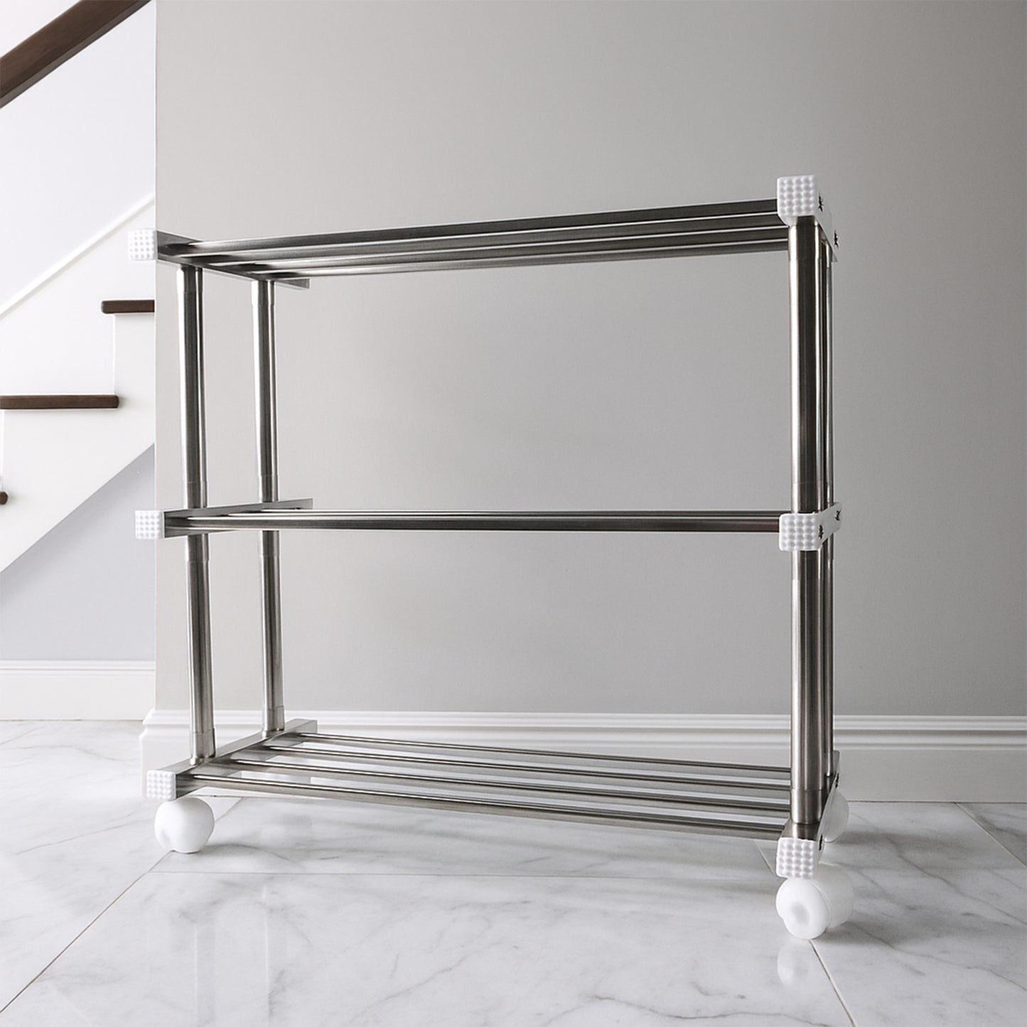 Stainless steel Supermom shoe storage rack by Wukusy, versatile home organization rack with multiple shelves for shoes and accessories.