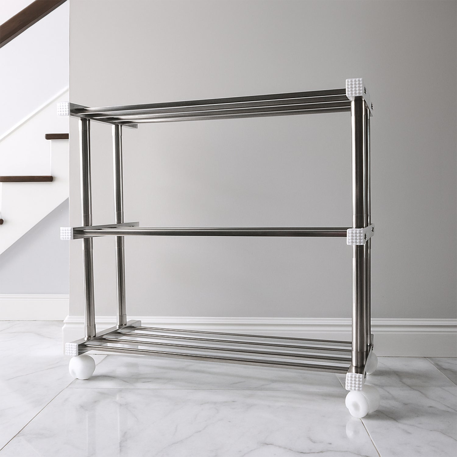 Stainless steel Supermom shoe storage rack by Wukusy, versatile home organization rack with multiple shelves for shoes and accessories.