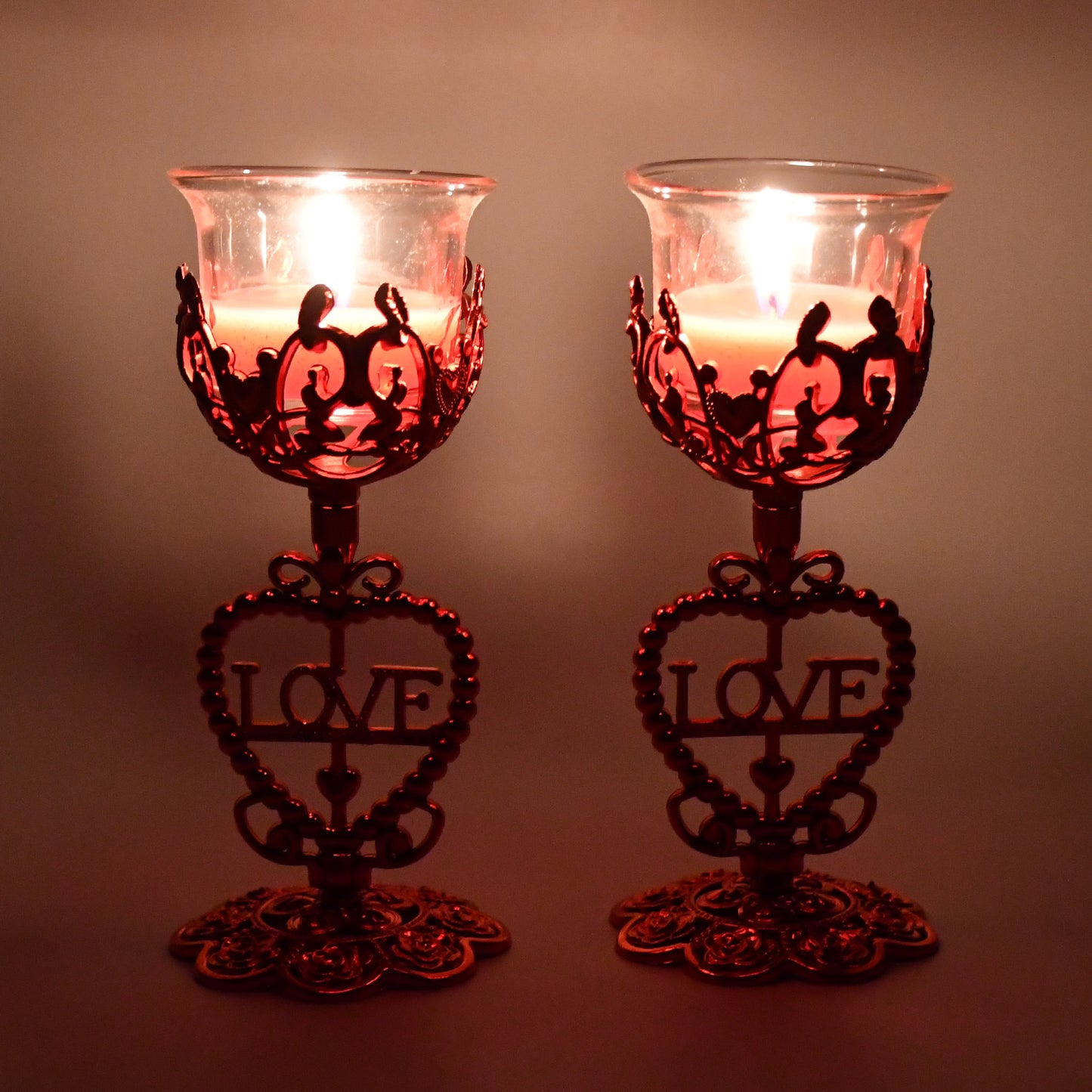 Wukusy tea lights holder candle stand set with two decorative metal candle holders for home decor and ambiance.