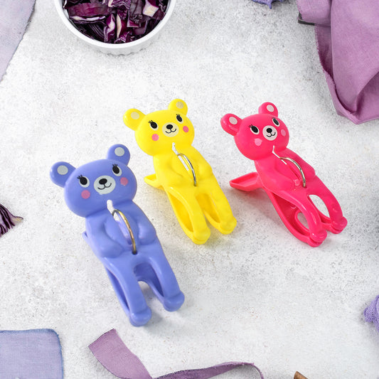 Set of three Wukusy windproof plastic towel clips for outdoor use, ideal for securing towels on clotheslines and avoiding wind disruption.