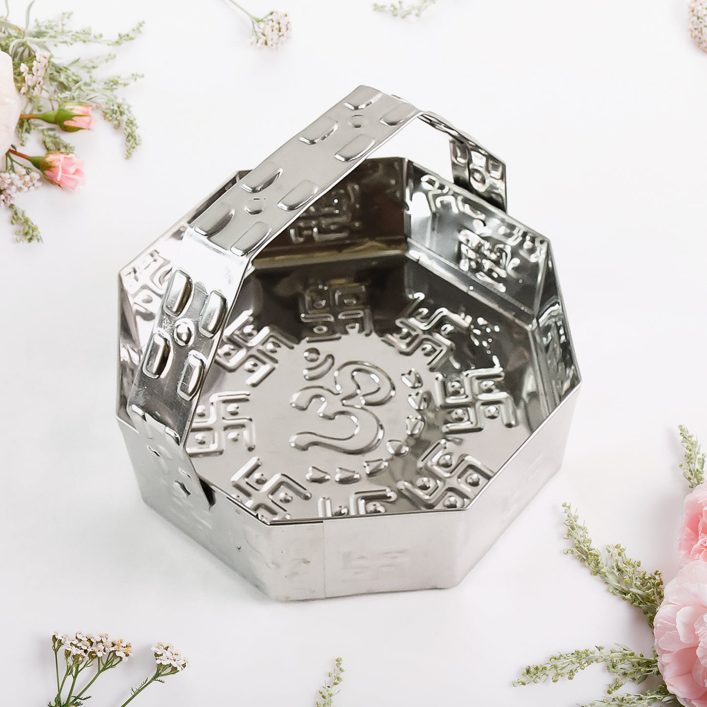 Traditional stainless steel octagon pooja basket with handle, ideal for home improvement and religious rituals.