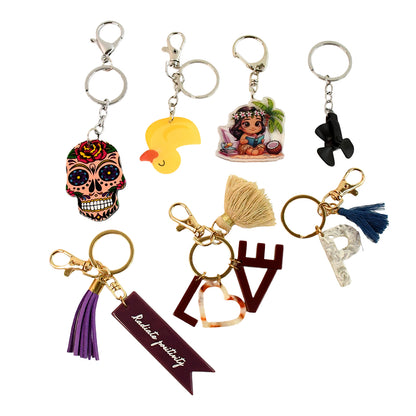 Wukusy trendy designer assorted keychains with mix of designs, ideal for home improvement or decorative use.