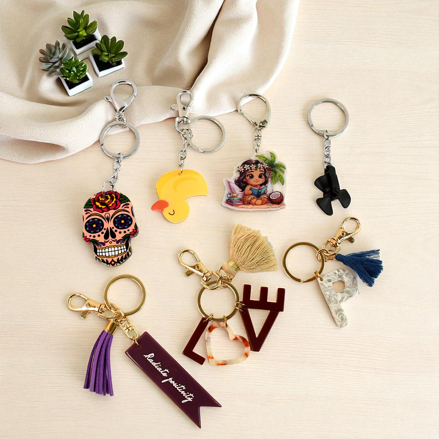 Wukusy trendy designer assorted keychain with mixed designs, perfect for home improvement or decorative use.