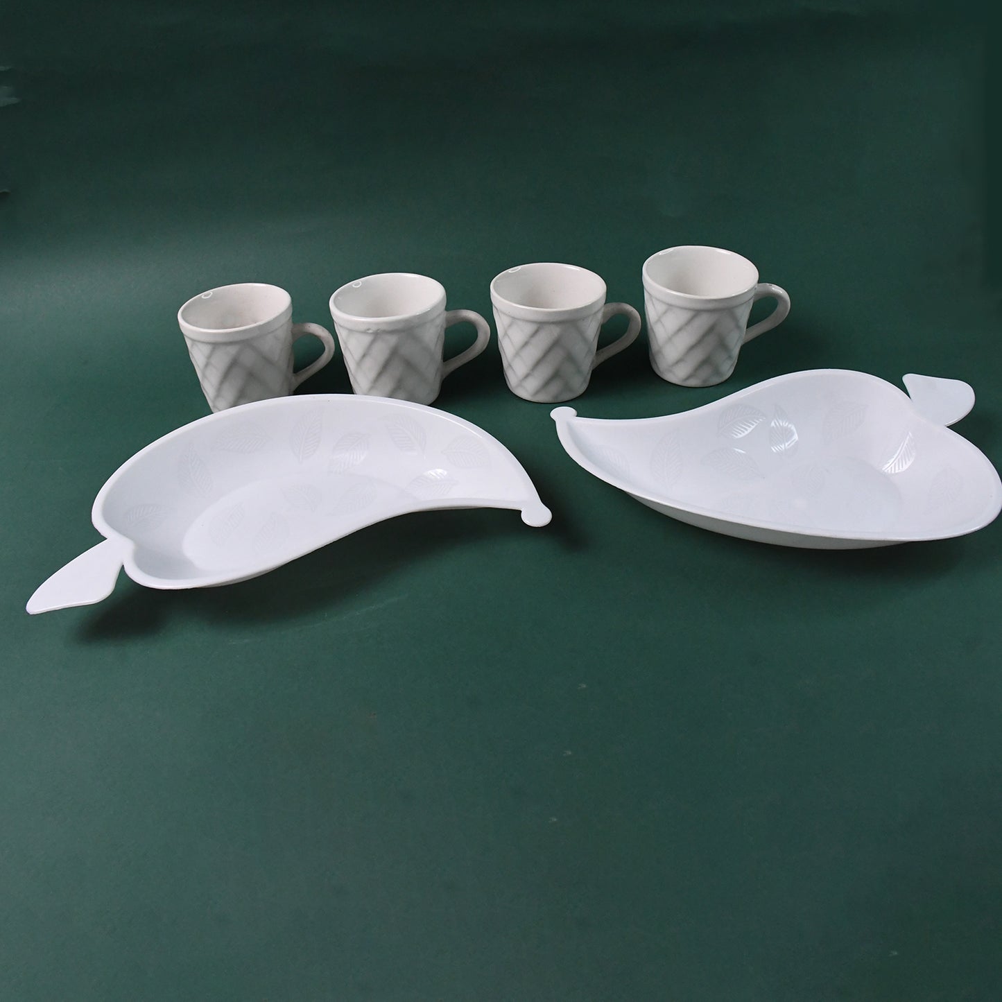 Six Unibic ceramic tea cups with a plastic leaf-shaped tray, set for home improvement and tea serving by Wukusy.