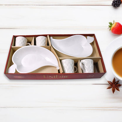 Set of six Unibic ceramic tea cups with a plastic leaf-shaped tray, arranged on a wooden surface for home improvement use.