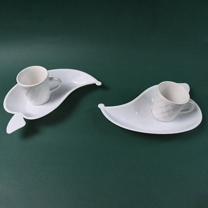 Set of six Unibic ceramic tea cups with a plastic leaf-shaped tray, perfect for serving tea in a stylish home improvement setting.