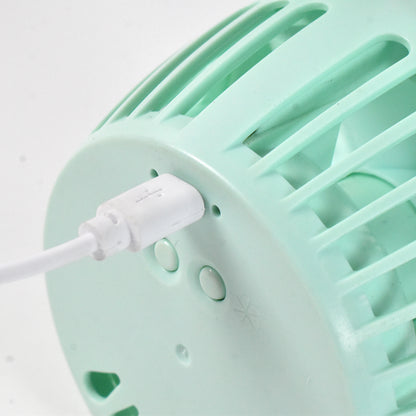 Wukusy USB desk fan, plastic home improvement device, compact and portable cooling fan on a desk surface.