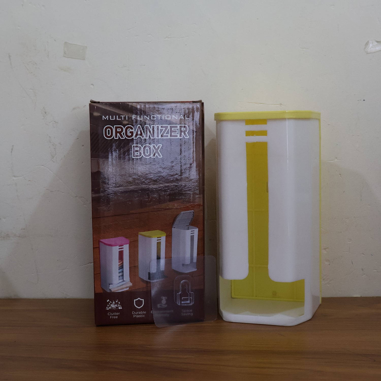 Wall-mounted plastic bag holder by Wukusy, designed for home improvement, showing the plastic bag storage solution mounted on the wall.