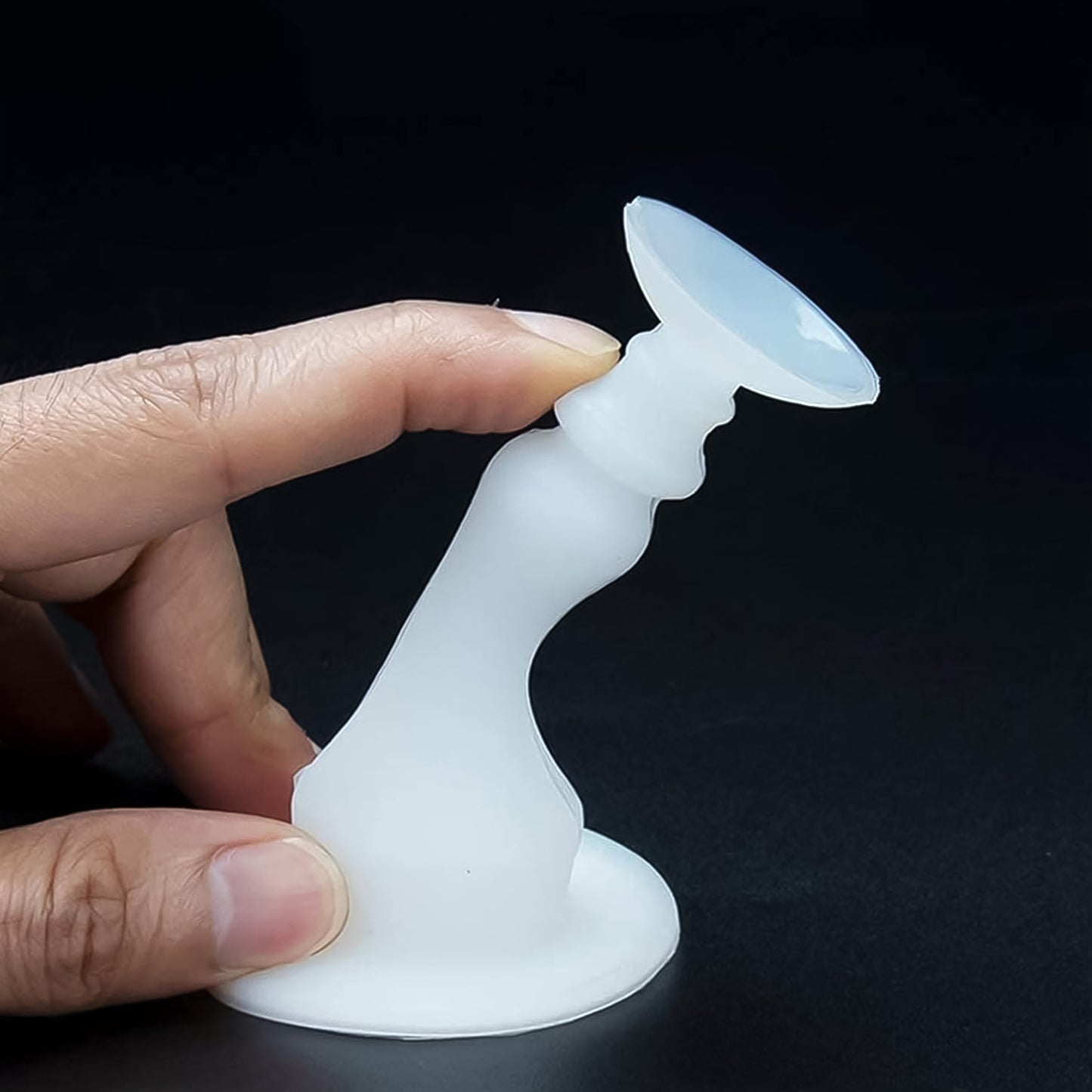 White washing machine door holder and stopper by Wukusy, designed to keep the washing machine door open securely.