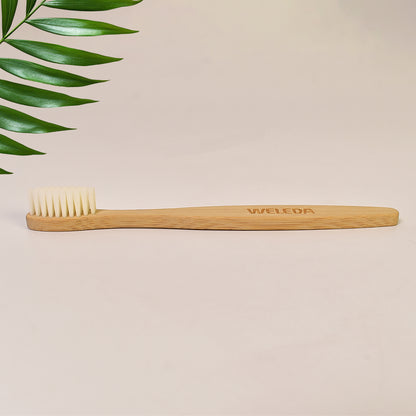 Wukusy wooden bamboo toothbrush with ultra-soft bristles, eco-friendly dental care tool for gentle cleaning.