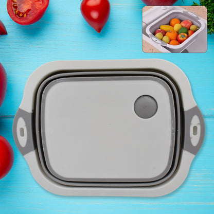 Wukusy collapsible cutting board with built-in dish tub basket for easy food prep and dish drying in the kitchen.