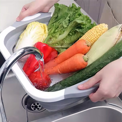Wukusy collapsible cutting board with built-in dish tub basket for kitchen prep and dishwashing, space-saving design.