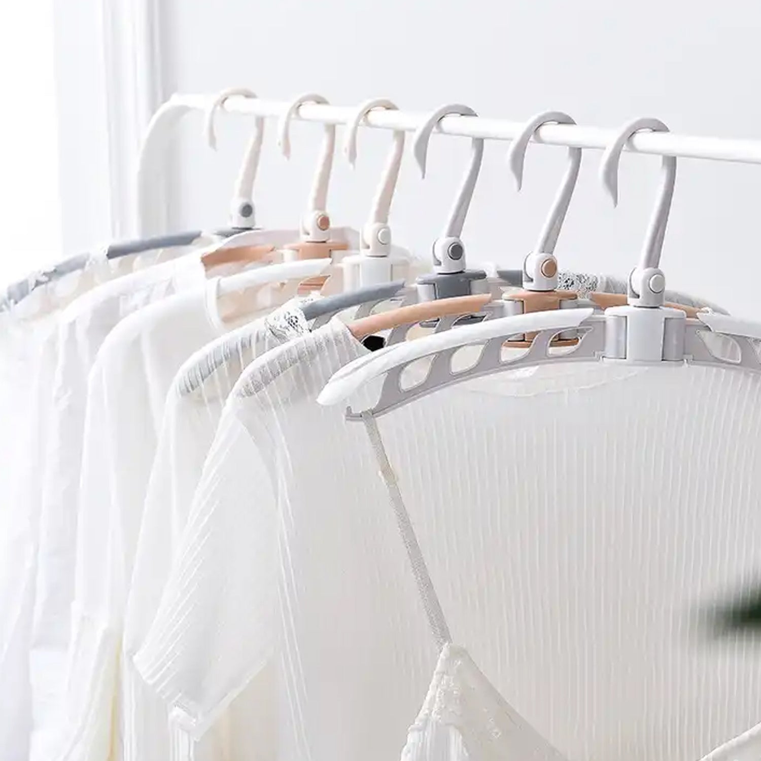 Wukusy portable folding clothes hanger with 360-degree rotating hooks, foldable travel drying rack, adjustable and lightweight.