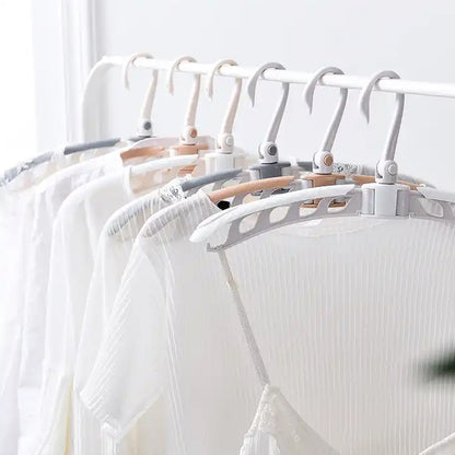 Wukusy portable folding clothes hanger with 360-degree rotating hooks, foldable travel drying rack, adjustable and lightweight.