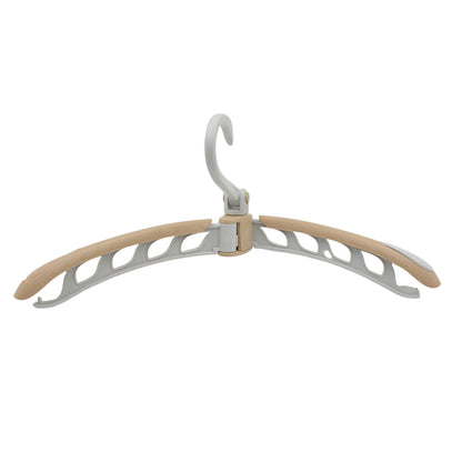 Wukusy portable folding clothes hanger with 360-degree rotation, adjustable, travel-friendly drying rack, foldable for easy packing.