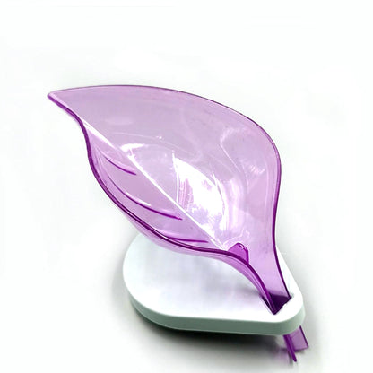 Wukusy leaf-shaped soap tray with suction cup, self-draining plastic soap box for bathroom and kitchen storage.