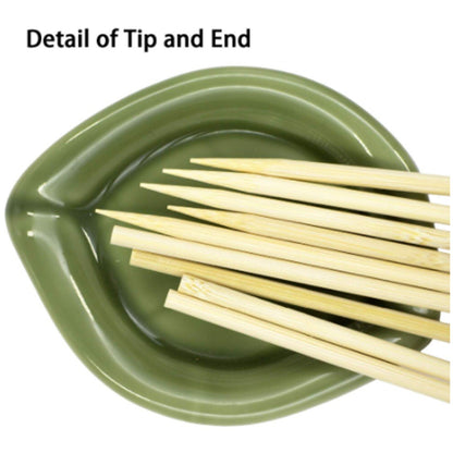 Wukusy natural bamboo wooden skewers for barbeque and grilling, shown arranged on a kitchen surface ready for use