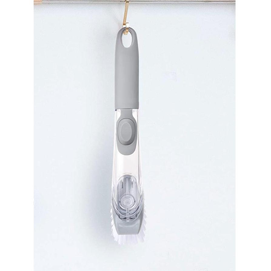 Wukusy 1271 automatic liquid dispenser dish brush and scrubber for kitchen cleaning, with soap dispensing and ergonomic handle.