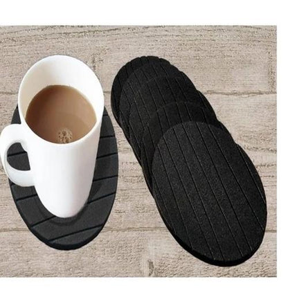 Set of 6 round silicone cup coasters by Wukusy, plain, flexible, and heat-resistant for tea, coffee, or wine glasses at home.