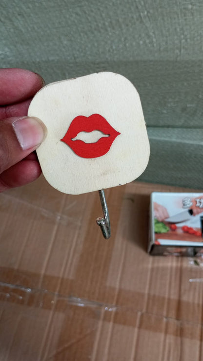 Wukusy wooden cartoon wall hook with multiple hooks for hats, coats, backpacks, towels, and clothes in a home or kitchen setting.