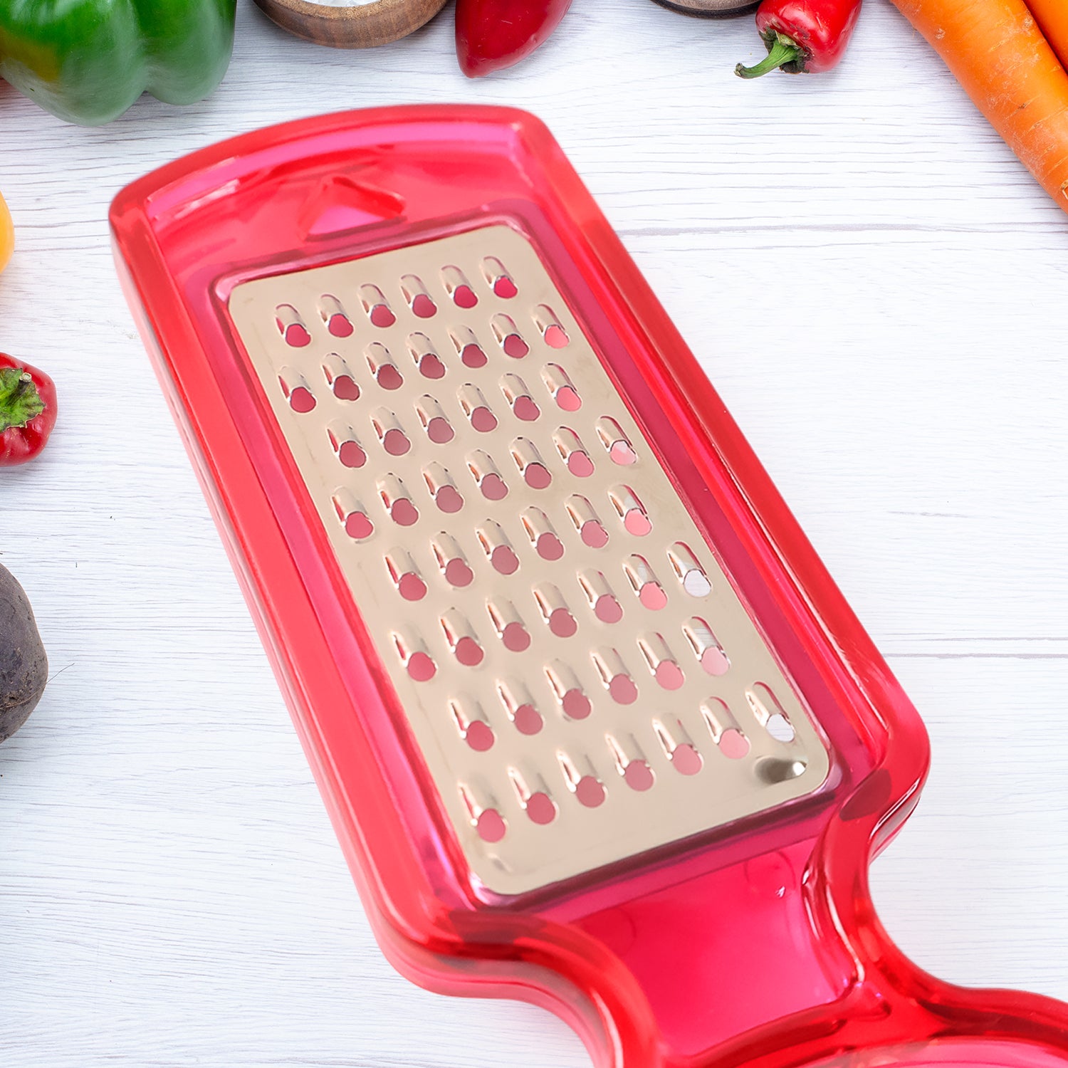 Wukusy 2-in-1 multifunctional kitchen peeler with grater, stainless steel blade, and ergonomic handle for peeling and grating tasks.