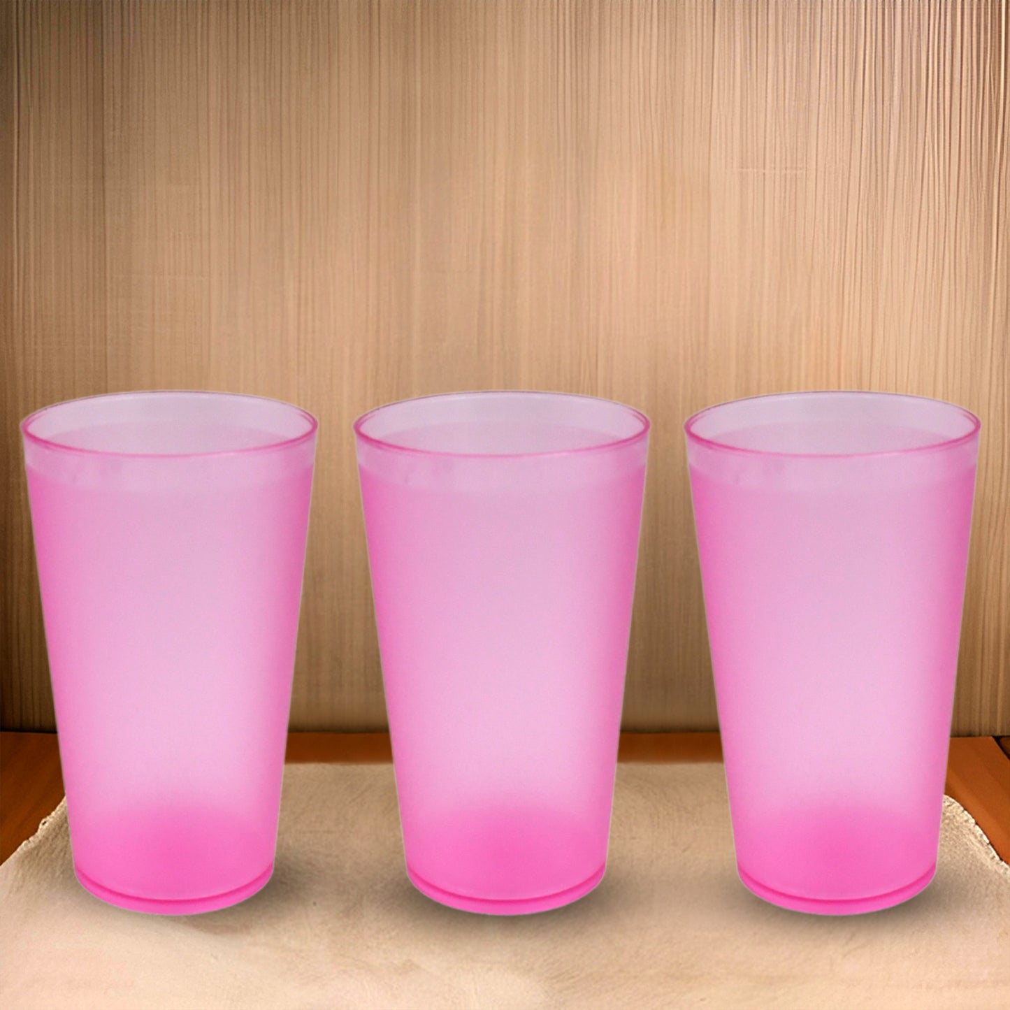 Six large Wukusy plastic glasses, 300ml each, used for drinking water and beverages in home, kitchen, and office settings.