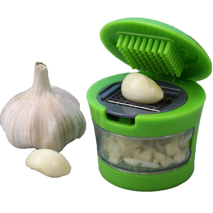 Wukusy ginger garlic crusher for kitchen, handheld stainless steel tool for grinding fresh ginger and garlic easily.