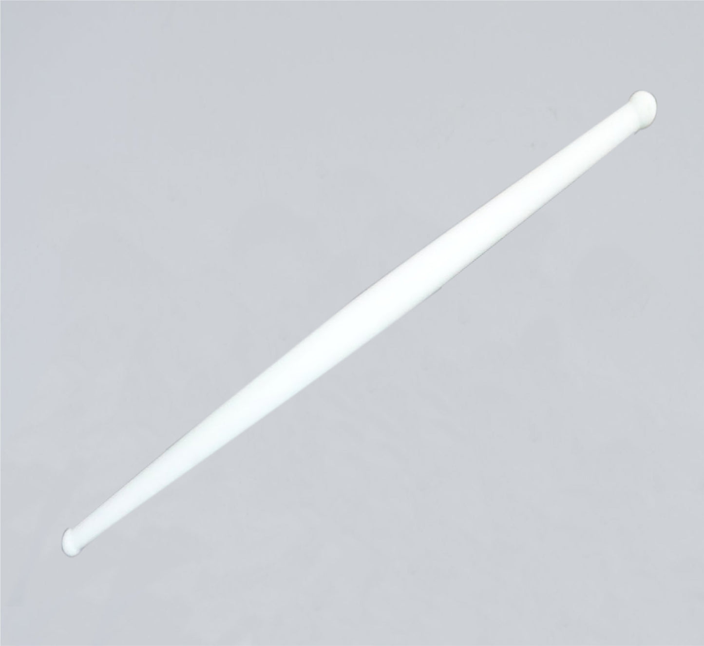 White plastic rolling belan for chapati making by Wukusy, used for rolling dough in home and kitchen cooking.