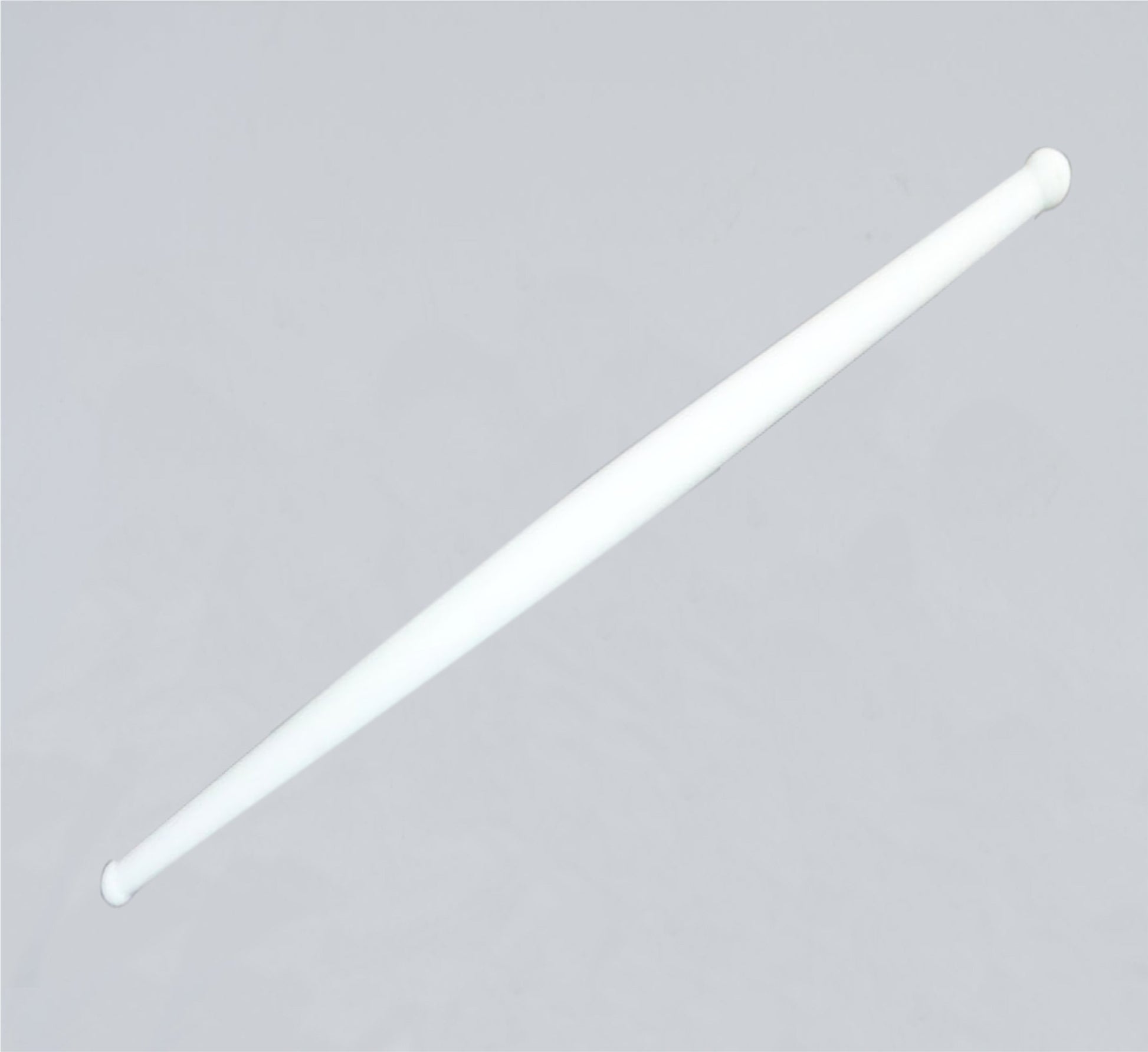 White plastic rolling belan for chapati making by Wukusy, used for rolling dough in home and kitchen cooking.