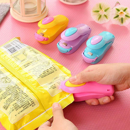 Wukusy 215 Handheld Sealer Mini Sealing Machine for home and kitchen use, compact sealing device in black.