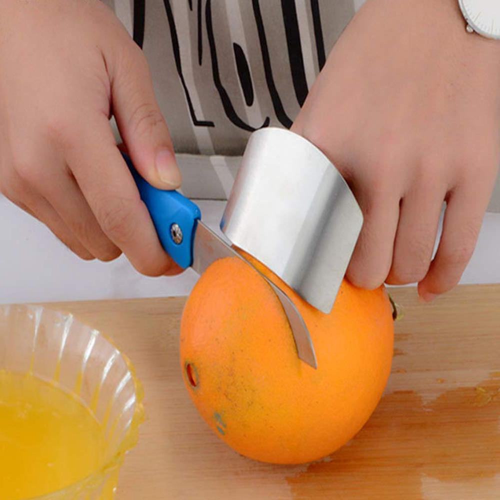 Wukusy stainless steel finger guard cutting protector for home and kitchen safety, prevents cuts during food preparation.