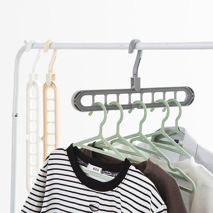 Wukusy 9-hole plastic hanger hook for indoor wardrobe, clothes organization, storage, balcony, or windowsill use.