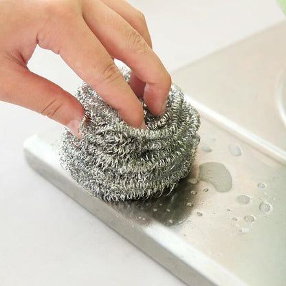 Set of 12 Wukusy stainless steel round shape ball scrubbers for kitchen cleaning and dishwashing.