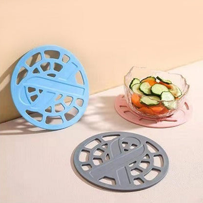 Wukusy silicone fancy coaster for holding bowls and utensils, versatile kitchen accessory with colorful, textured surface.
