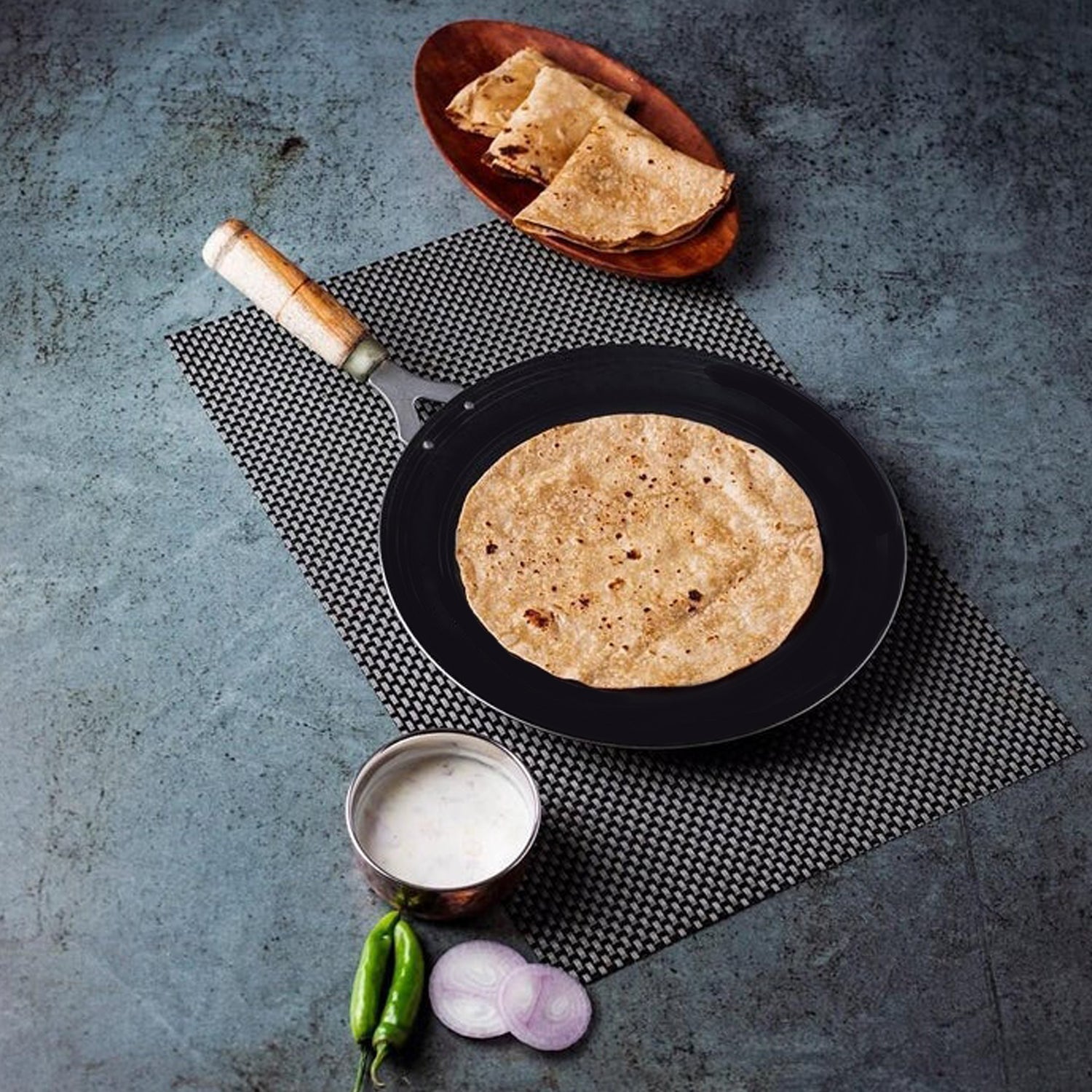 Wukusy wooden handle roti tawa for making rotis and parathas in household kitchens, with a sturdy wooden handle.