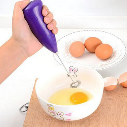 Wukusy hand blender for mixing and blending food at home, with ergonomic handle and stainless steel blending shaft.