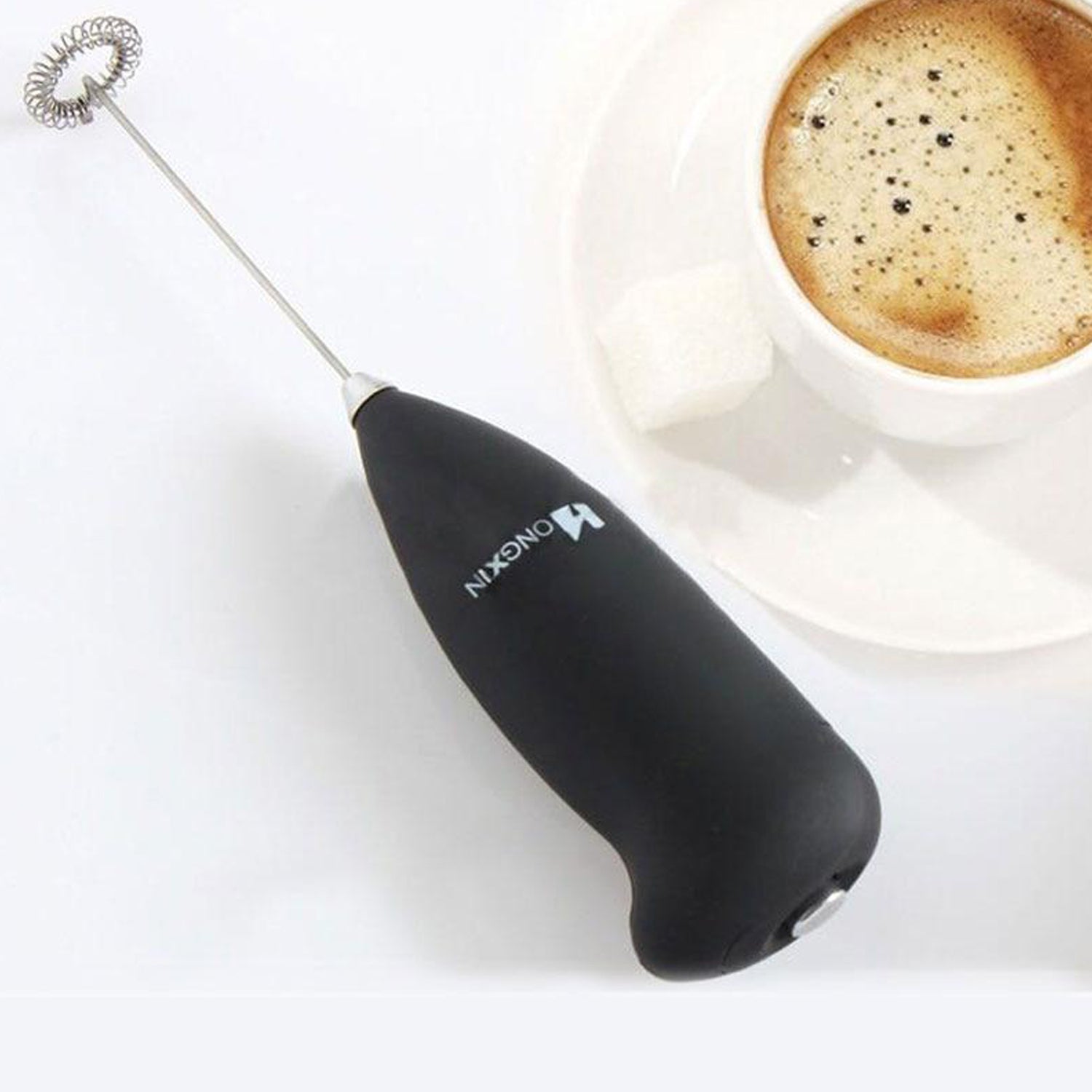 Wukusy hand blender for mixing and blending food items in a home kitchen setting. Compact and easy to use for various food preparations.