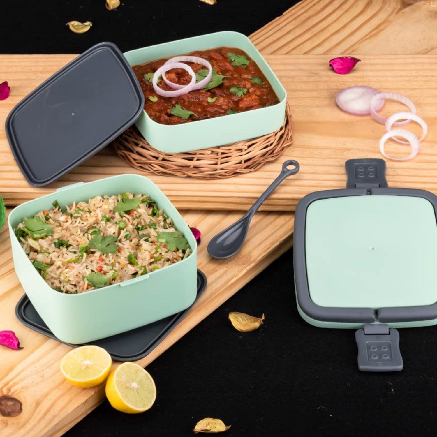 Green Wukusy double-layer portable lunch box with handle and spoon, stackable design for easy lunch storage.