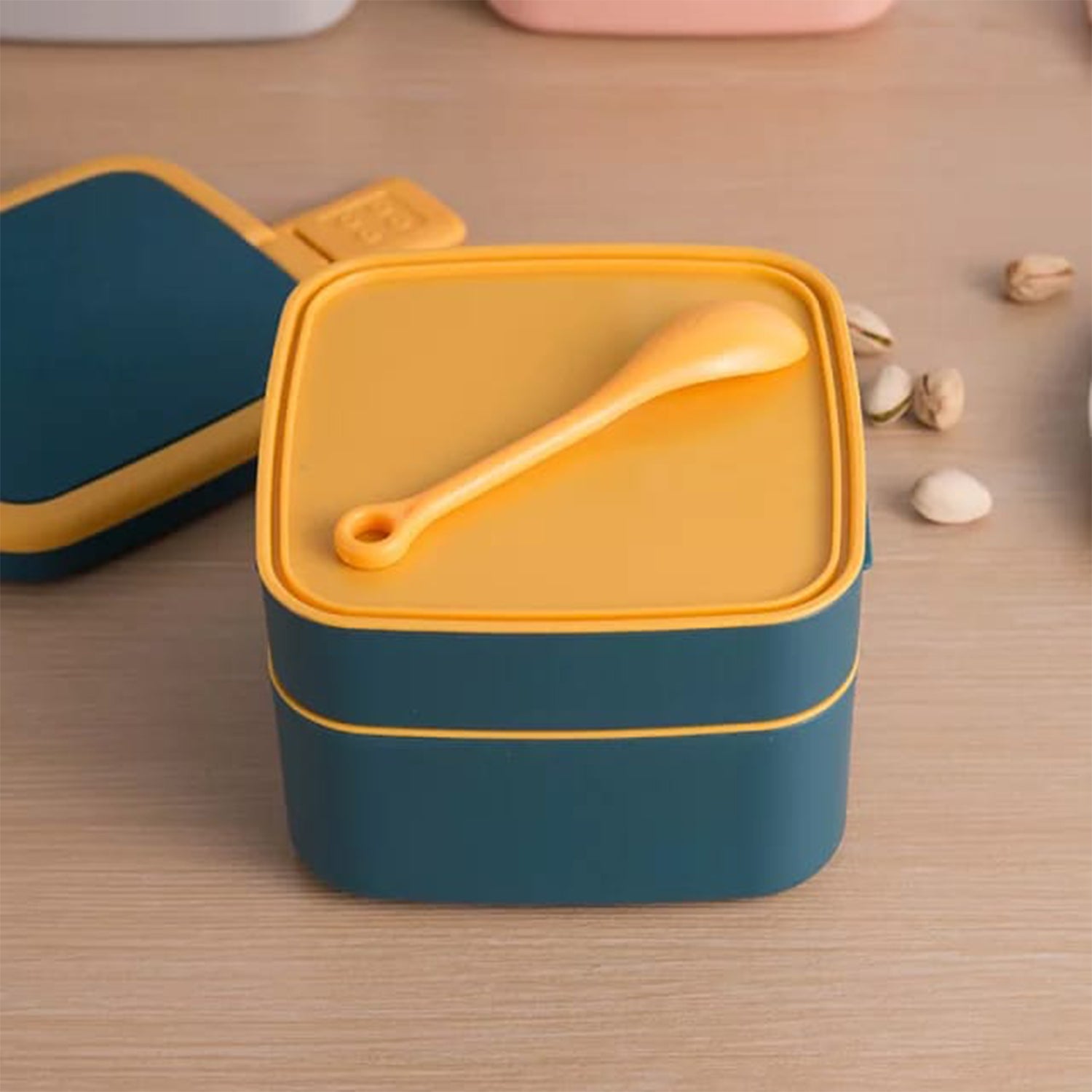 Blue Wukusy double-layer portable lunch box with handle and spoon, stackable design for convenient meal storage and transport.