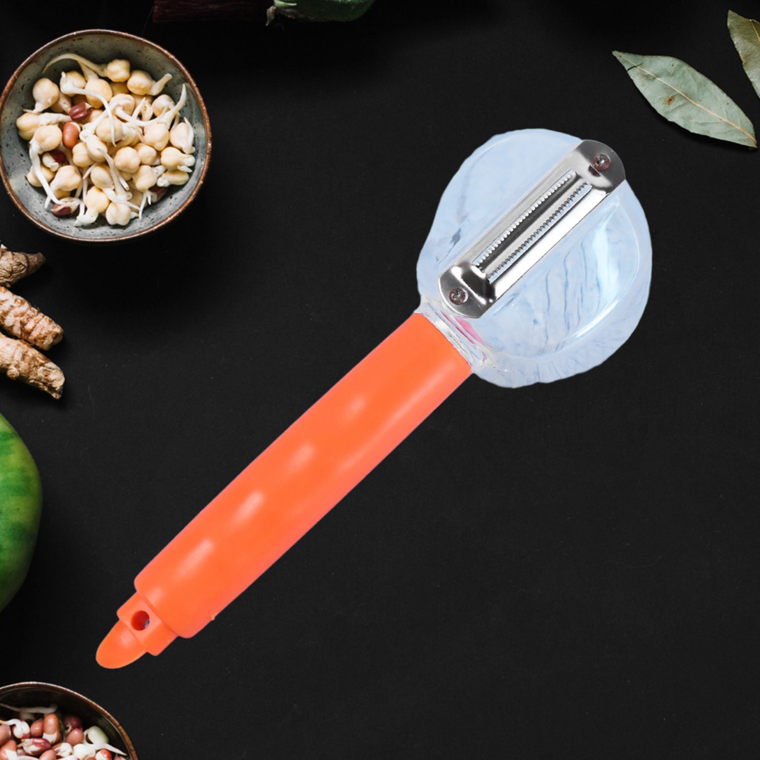 Wukusy stainless steel vegetable peeler with container for carrots, cucumbers, apples, and other fruits and vegetables in a home kitchen setting.