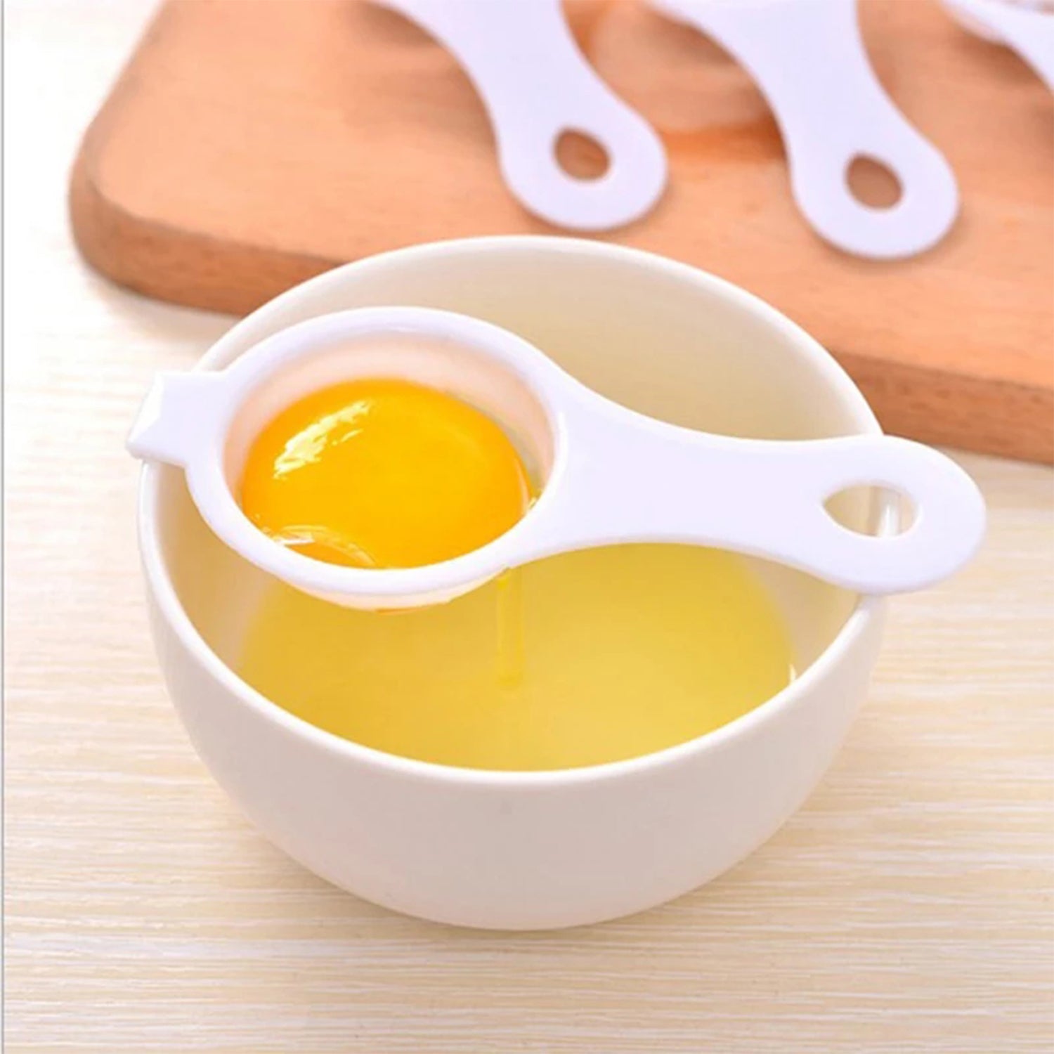 Wukusy egg yolk separator and egg white filter with spoon, kitchen tool for separating egg yolks and whites in home cooking.