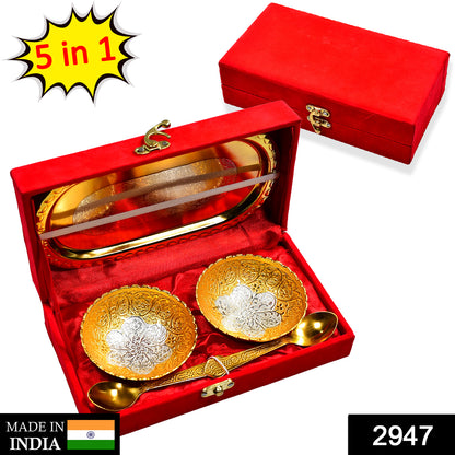 Gold and silver plated brass tray set with two bowls and spoons, presented in a red velvet gift box, ideal for serving dry fruits and desserts.