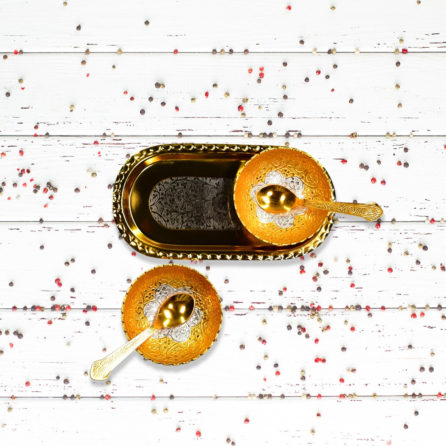 Gold and silver plated brass tray set with two bowls and spoons, presented in a red velvet gift box for serving dry fruits and desserts.