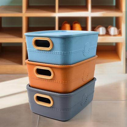 Set of three Wukusy plastic storage baskets with handles, ideal for organizing home and kitchen spaces.