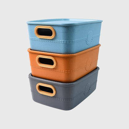 Set of three Wukusy plastic storage baskets with handles, versatile for home and kitchen organization.